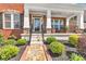 Cozy front porch featuring stone accents, decorative railing, and well-maintained landscaping at 3120 Abbey Sw Dr, Atlanta, GA 30331