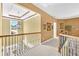 Upstairs hallway featuring decorative lighting, wainscoting and a window at 3120 Abbey Sw Dr, Atlanta, GA 30331