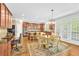 Eat-in kitchen with stainless steel appliances, center island, and doors leading to back deck at 3120 Abbey Sw Dr, Atlanta, GA 30331