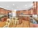 Spacious kitchen with granite countertops, wooden cabinets, and stainless steel appliances at 3120 Abbey Sw Dr, Atlanta, GA 30331