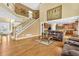 Elegant living area featuring a staircase, hardwood floors, and open kitchen access at 3120 Abbey Sw Dr, Atlanta, GA 30331