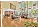 Open-concept living room with soaring ceilings, hardwood floors, and large windows at 3120 Abbey Sw Dr, Atlanta, GA 30331