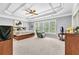 Main bedroom showcasing tray ceiling, large windows, and carpeting at 3120 Abbey Sw Dr, Atlanta, GA 30331