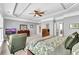 Main bedroom with a decorative ceiling, carpet floors, and ample closet space at 3120 Abbey Sw Dr, Atlanta, GA 30331
