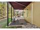 Spacious covered patio with outdoor lounge area, providing a comfortable space at 3120 Abbey Sw Dr, Atlanta, GA 30331