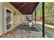 Spacious covered patio with outdoor lounge area, providing a comfortable space at 3120 Abbey Sw Dr, Atlanta, GA 30331