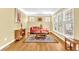Bright sitting room features hardwood floors, a comfortable couch, and natural light at 3120 Abbey Sw Dr, Atlanta, GA 30331
