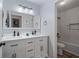 Bright bathroom with double vanity, modern fixtures, and separate bathtub/shower at 401 Berkeley Woods Dr, Duluth, GA 30096