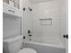 Clean and modern bathroom with a shower/tub combination and tiled walls at 401 Berkeley Woods Dr, Duluth, GA 30096