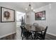 Dining area featuring modern lighting and dark hardwood floors adjacent to kitchen at 401 Berkeley Woods Dr, Duluth, GA 30096