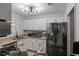 Well-lit kitchen featuring stainless steel appliances, and ample cabinet space at 401 Berkeley Woods Dr, Duluth, GA 30096