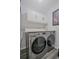 Laundry area featuring updated front load washer and dryer with ample countertop space at 401 Berkeley Woods Dr, Duluth, GA 30096