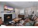 Bright living room with a fireplace, hardwood floors, and an open layout at 401 Berkeley Woods Dr, Duluth, GA 30096