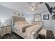 Inviting main bedroom with a ceiling fan, a picture window, and neutral décor at 401 Berkeley Woods Dr, Duluth, GA 30096