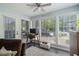 Bright sunroom with large windows and ample natural light overlooking the backyard at 401 Berkeley Woods Dr, Duluth, GA 30096