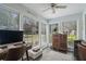 Sunroom featuring a desk area and large windows for plenty of natural light at 401 Berkeley Woods Dr, Duluth, GA 30096