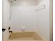 This bathroom features a bathtub with a handheld shower head and a towel rack at 6141 Windsong Way, Smoke Rise, GA 30087