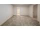 Neutral bedroom featuring carpet flooring and closet for storage at 6141 Windsong Way, Smoke Rise, GA 30087