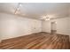 A bedroom featuring wood laminate flooring, recessed lighting, and two closets at 6141 Windsong Way, Smoke Rise, GA 30087