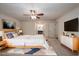 This virtually staged bedroom features neutral carpet and light walls at 6141 Windsong Way, Smoke Rise, GA 30087