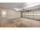 Attached garage with a large garage door at 6141 Windsong Way, Smoke Rise, GA 30087