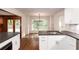 Kitchen view of stainless steel appliances and fixtures, combined with dining room at 6141 Windsong Way, Smoke Rise, GA 30087
