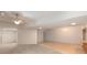 Spacious living room featuring neutral carpet, a ceiling fan, and recessed lighting, perfect for entertaining and relaxation at 6141 Windsong Way, Smoke Rise, GA 30087