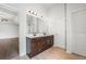 Bathroom featuring granite countertops, double sinks, dark cabinets and great lighting at 327 Morning Frost, Canton, GA 30114