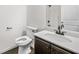 Bathroom with white cabinets, marble countertop, and brushed black fixtures at 327 Morning Frost, Canton, GA 30114