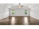 Expansive bedroom featuring tray ceilings and large windows offering natural light at 327 Morning Frost, Canton, GA 30114
