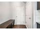 Functional entryway with a bench and storage cabinets, providing a welcoming space at 327 Morning Frost, Canton, GA 30114