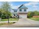 Beautiful two-story home with brick facade, well-manicured lawn, and inviting curb appeal at 327 Morning Frost, Canton, GA 30114