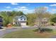 Charming home with well-maintained landscaping, a two-car garage, and a welcoming front porch at 327 Morning Frost, Canton, GA 30114