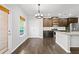 Bright kitchen area featuring a breakfast nook with a window and modern lighting fixture at 327 Morning Frost, Canton, GA 30114