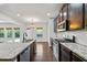 Open concept kitchen with granite countertops, stainless steel appliances, and ample natural light at 327 Morning Frost, Canton, GA 30114