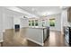 Spacious open-concept kitchen with a view of the living area and fireplace at 327 Morning Frost, Canton, GA 30114