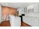 Modern kitchen with granite countertops, stainless steel appliances, and attractive brick accent wall at 327 Morning Frost, Canton, GA 30114