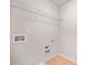 A compact laundry room featuring hookups and a shelf for storage at 327 Morning Frost, Canton, GA 30114