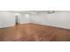Spacious living room with hardwood floors and white walls with recessed lights at 327 Morning Frost, Canton, GA 30114