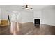Bright living room with stairs leading upstairs and a fireplace at 327 Morning Frost, Canton, GA 30114