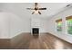 Spacious living room with ceiling fan and fireplace, offering a cozy atmosphere at 327 Morning Frost, Canton, GA 30114