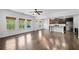 Spacious living area connected to kitchen, featuring hardwood flooring and natural light at 327 Morning Frost, Canton, GA 30114