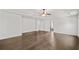 Spacious main bedroom featuring tray ceilings, ceiling fan, and dark hardwood floors at 327 Morning Frost, Canton, GA 30114