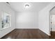 Bright room with large window and dark wood floors, suitable for an office or den at 327 Morning Frost, Canton, GA 30114