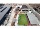 Aerial view of an outdoor bar and recreational area with turf, tables, and ample seating in an urban location at 4915 Bergen Ct, Cumming, GA 30040