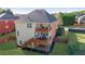 Large backyard featuring a two-story deck, perfect for entertaining, and a well-manicured lawn at 4915 Bergen Ct, Cumming, GA 30040