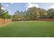 Expansive backyard with a well-maintained lawn and privacy fence, great for outdoor activities at 4915 Bergen Ct, Cumming, GA 30040