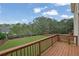 Inviting backyard view from the deck, featuring a lush lawn and mature trees at 4915 Bergen Ct, Cumming, GA 30040