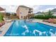 Backyard featuring a luxurious pool, patio, and a well-maintained lawn, perfect for outdoor relaxation at 4915 Bergen Ct, Cumming, GA 30040