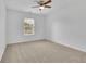 Bright room with a modern ceiling fan and a window with outside view at 4915 Bergen Ct, Cumming, GA 30040